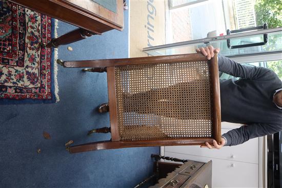 A George III mahogany Bergere with leather squab